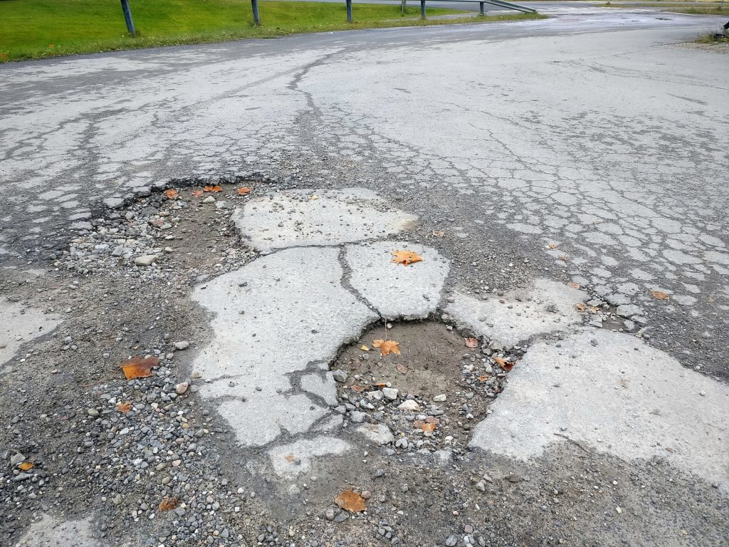 Potholes are a surefire sign you need a driveway replacement