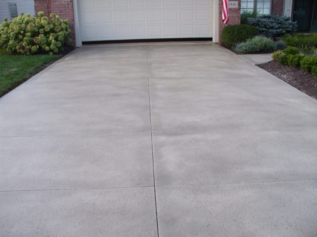 Concrete driveway on a residential property after RCR's concrete repair services