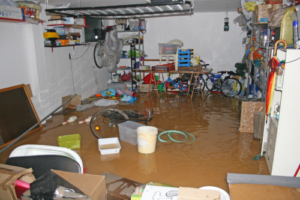 flooded garage with floating debris