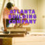 Atlanta building company written in purple over man cutting wood with circular saw