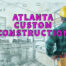 Atlanta custom construction written in pink over contractor looking at drawn plans for bathroom remodel