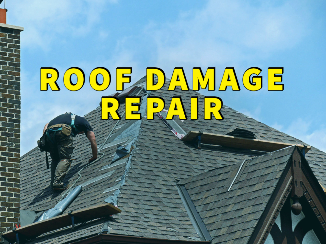 roof damage repair written in yellow over roofer on roof fixing shingles with blue sky in background