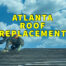 Atlanta roof replacement written in yellow with blue sky in the background while man works on roof beneath letters
