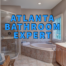 Atlanta bathroom expert written in blue over renovated standing shower, bathtub, and sink