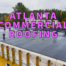 Atlanta commercial roofing written in purple over black flat commercial roof