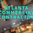Atlanta commercial contractor written in teal over overhead shot of warehouse floor with workers