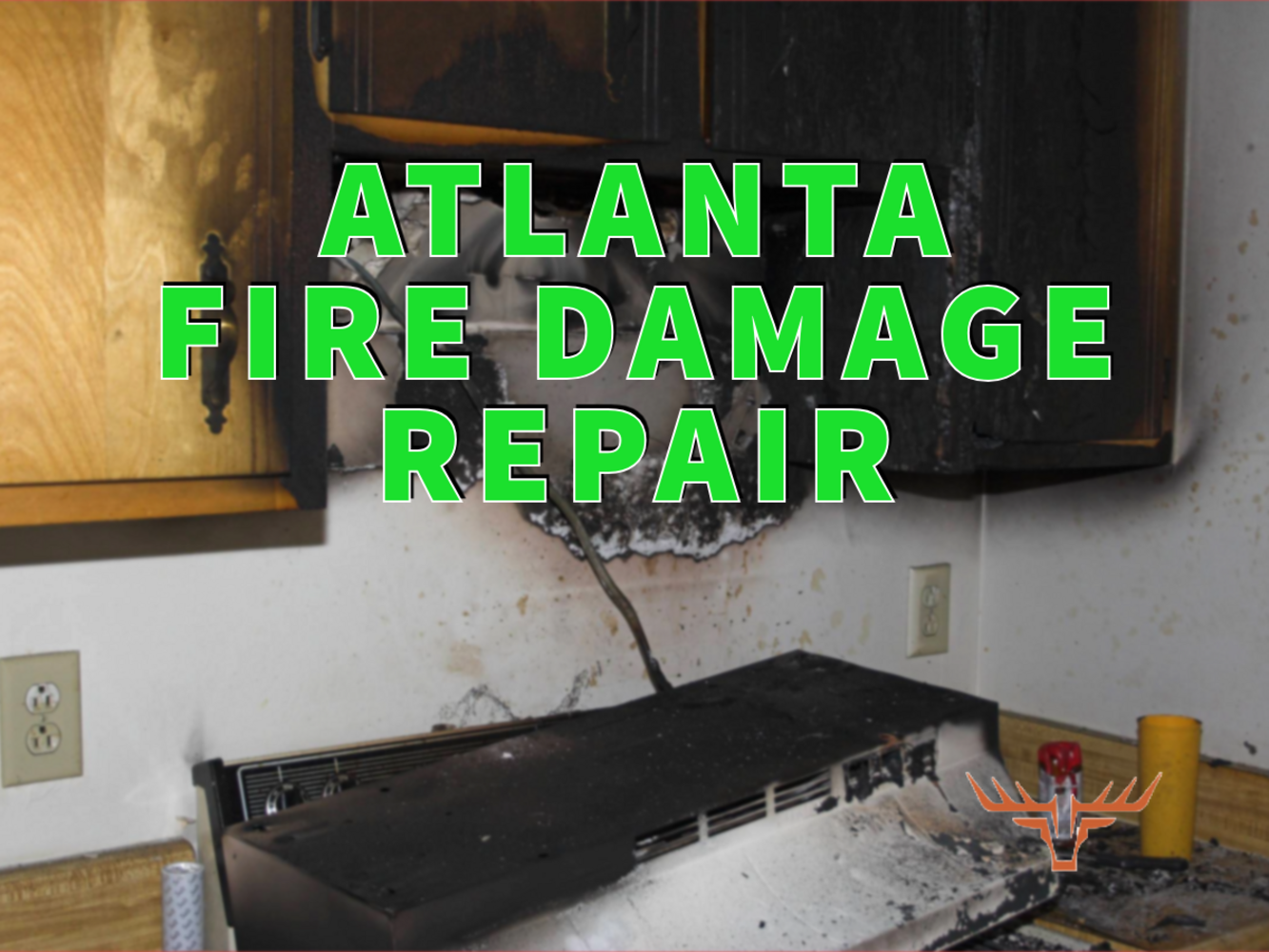 Atlanta fire damage repair written in green over fire-damaged stove