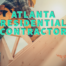 Atlanta residential contractor written over worker fastening wood together