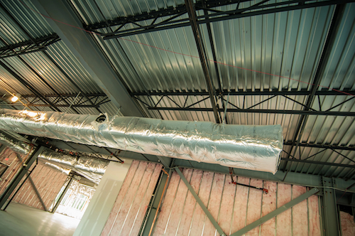 interior view of HVAC system in unfinished commercial space